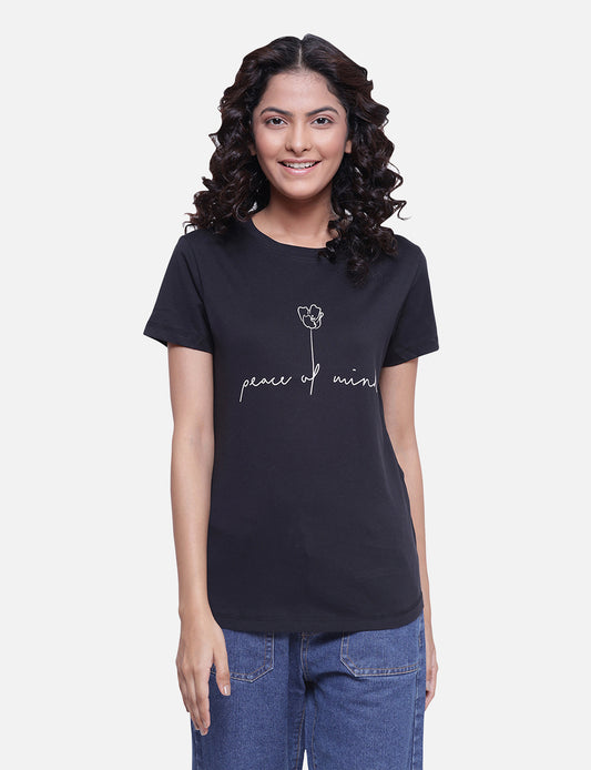 Women's black T-shirt with a bold white quote, perfect for a stylish and edgy look, available online